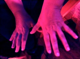Close-up of hands playing an instrument